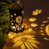 iHeartDogs sunflowers-paws lantern glows at night, creating a warm garden ambiance.