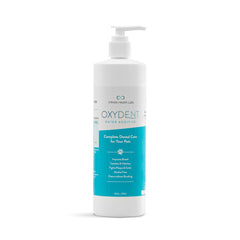 Infinite Health Labs Oxydent bottle on kitchen counter for easy pet dental care