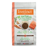 Instinct Be Natural salmon brown rice dog food bag highlights high-protein, grain-inclusive nutrition