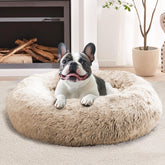 JOLLYVOGUE calming donut dog bed in cream brown for secure lounging.