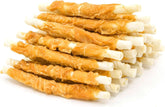 Jungle Calling chicken-wrapped rawhide twists in bag promote chewing engagement for dogs.