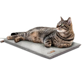 K&H Thermo-Kitty Mat on bed provides cozy warmth for indoor cats