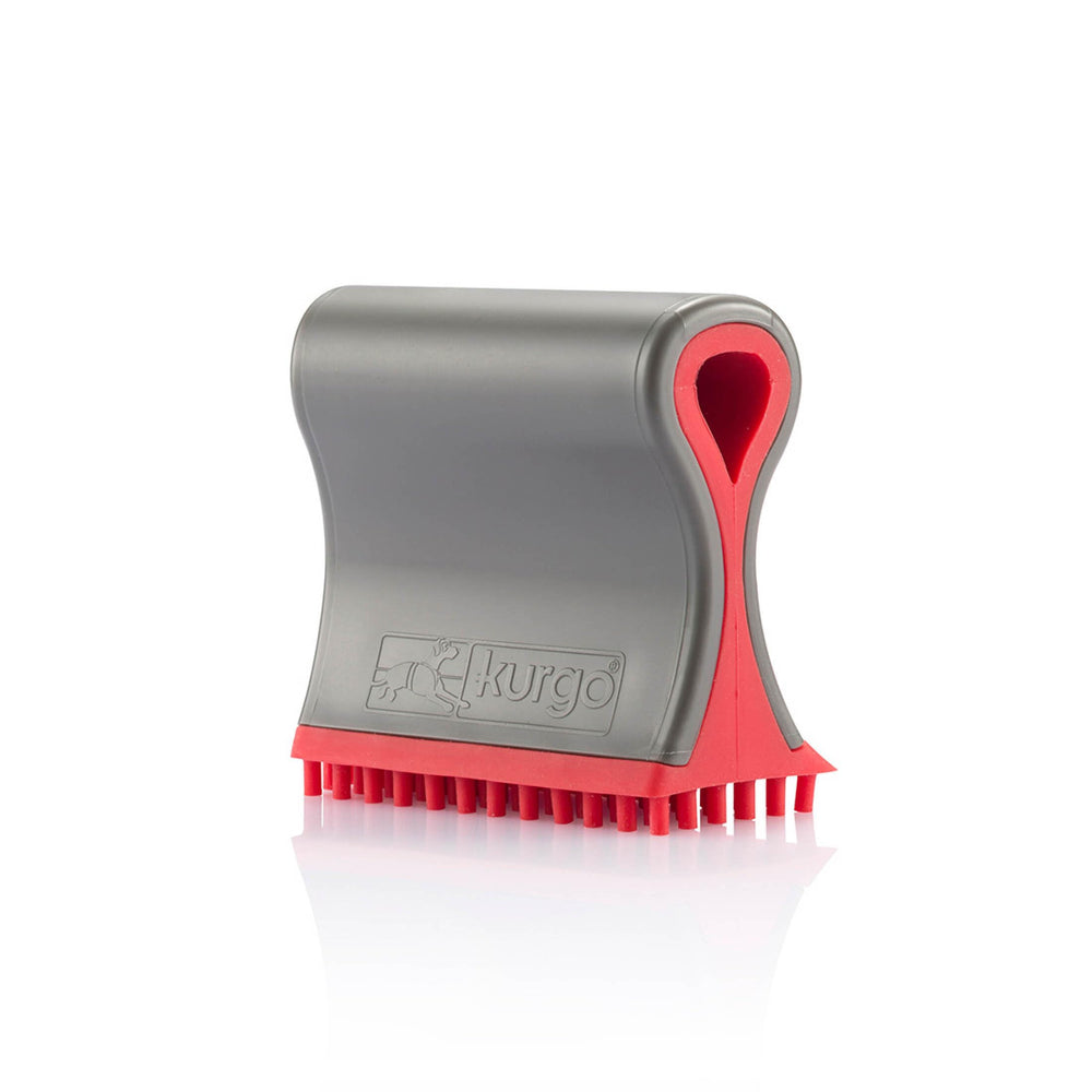 Kurgo Shed Sweeper on couch removes pet fur quickly and keeps furniture clean.
