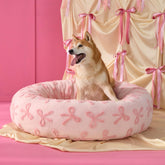 LE SURE Donut Bed on TV in pink taffy, offering cozy round comfort for pets.