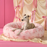 LE SURE Shown on TV donut bed in pink offers cozy warmth for pets.