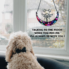 Leotrag dog memorial suncatcher window display with colorful light reflection.