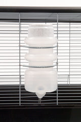 Heavy-duty spring clamp securing the Lixit bottle in place.
