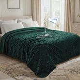 LOOBANI forest-green waterproof blanket front jacquard protects furniture from spills.