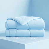 Luciphia cooling blanket on a sofa offers refreshing, cool comfort for resting pets