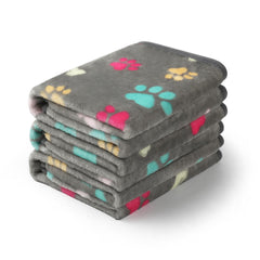 Luciphia paw-printed large grey throw on sofa showing pet-friendly protection and style