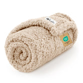 Luciphia Premium Fleece Pet Blanket in beige on a couch protecting furniture from pet fur.