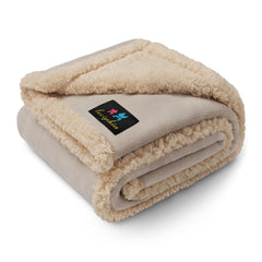 Luciphia waterproof pet blanket on sofa protects against spills and accidents.