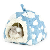 LyssKMK Bunny Bed blue sky cloud pattern offers a warm hideaway for rabbits.