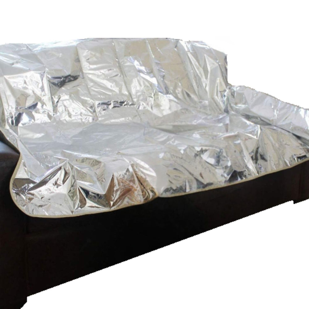 Maikuni Pet Repeller Pad on sofa, silver 72, helps deter pets from lounging and keeps furniture clean.