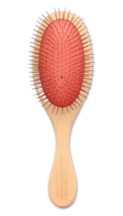 Mars Coat King brush showing soft rubber pad and rotating pins for flexible grooming on dogs and cats