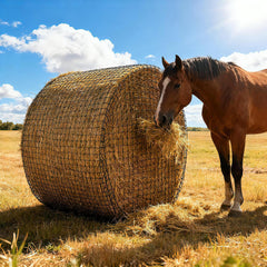 Martx 5X5ft round bale hay net ready for slow feeding in a stable.