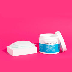 MAXI/GUARD wipes used on a dog for gentle cleaning and odor control.