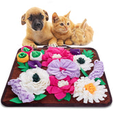 Meilzer snuffle mat with colorful flowers hiding treats for canine enrichment.