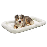 MidWest QuietTime dog bed with white fleece bolster for cozy crate lounging.