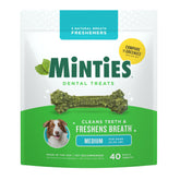 Minties packaging shows a 40-count bag for medium and large dogs, supporting dental care.