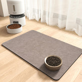 MontVoo absorbent pet feeding mat with two bowls keeps spills contained.