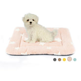 Mora Pets pink crate pad offers cozy cushioning for small dogs.