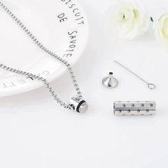 Compact MOROTOLE pendant sized 1.77 by 0.24 inches holds a small amount of ashes.
