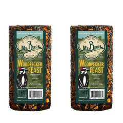 Mr. Bird Woodpecker Feast cylinder-two-pack hangs to attract woodpeckers.