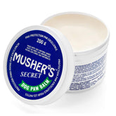 Musher's Secret 200g packshot showing natural paw wax for all-season protection.
