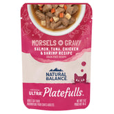 Natural Balance Platefulls Indoor Salmon-Tuna-Chicken-Shrimp pouch close-up showing gravy and protein variety.