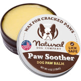 Natural Dog Company Paw Soother Balm tin close-up shows nourishing protection for dry paw pads.