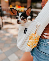 NATUYA small dog carrier sling adjustable strap in use.