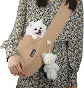 NATUYA small dog carrier sling in brown on model side view shows hands-free convenience.