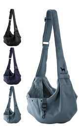 Noah & Paw dog sling carrier on model during a hands-free walk.