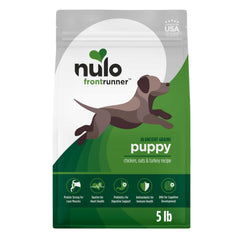 Nulo Frontrunner Puppy Food kibble close-up shows high-protein bites for lean muscle