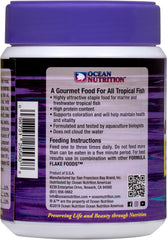 Reef tank feeding scene with Prime Reef Flakes promoting coloration and vitality