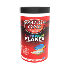 Omega One Super Color Flakes in a feeding dish illustrating easy dosing
