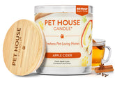 One Fur All Pet House Fall Candle Apple Cider jar emits a warm autumn scent for pet-friendly spaces.