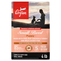 ORIJEN small breed puppy dry food bag close-up highlights premium WholePrey ingredients for growth