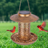 Ottsuls solar bird feeder lantern bronze design brightens evenings while attracting visiting birds.