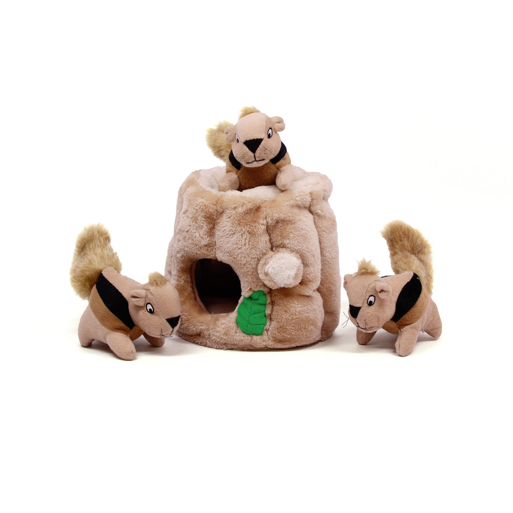 Outward Hound Hide-A-Squirrel puzzle toy on floor for interactive play and problem-solving.
