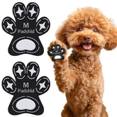 Padshld dog paw protectors with traction grips on hardwood floors for stable footing.