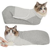 Pawfun self-adhesive grooming wrap securing a calm cat during nail trim