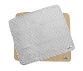 Pet Parents Pawtect Pads two-pack gray-tan on the floor offers reusable mess protection.