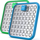 Pawtners stainless steel lick mat on crate promotes calm feeding.