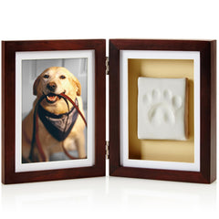 Pearhead paw print memorial frame beside a photo, a lasting keepsake for cherished memories
