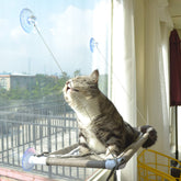 PEFUNY Cat Window Hammock beige mounted for sunlit lounging and space-saving placement.