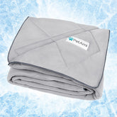 PetAmi Premium Cooling Blanket folded on a sofa offers cooling comfort for pets
