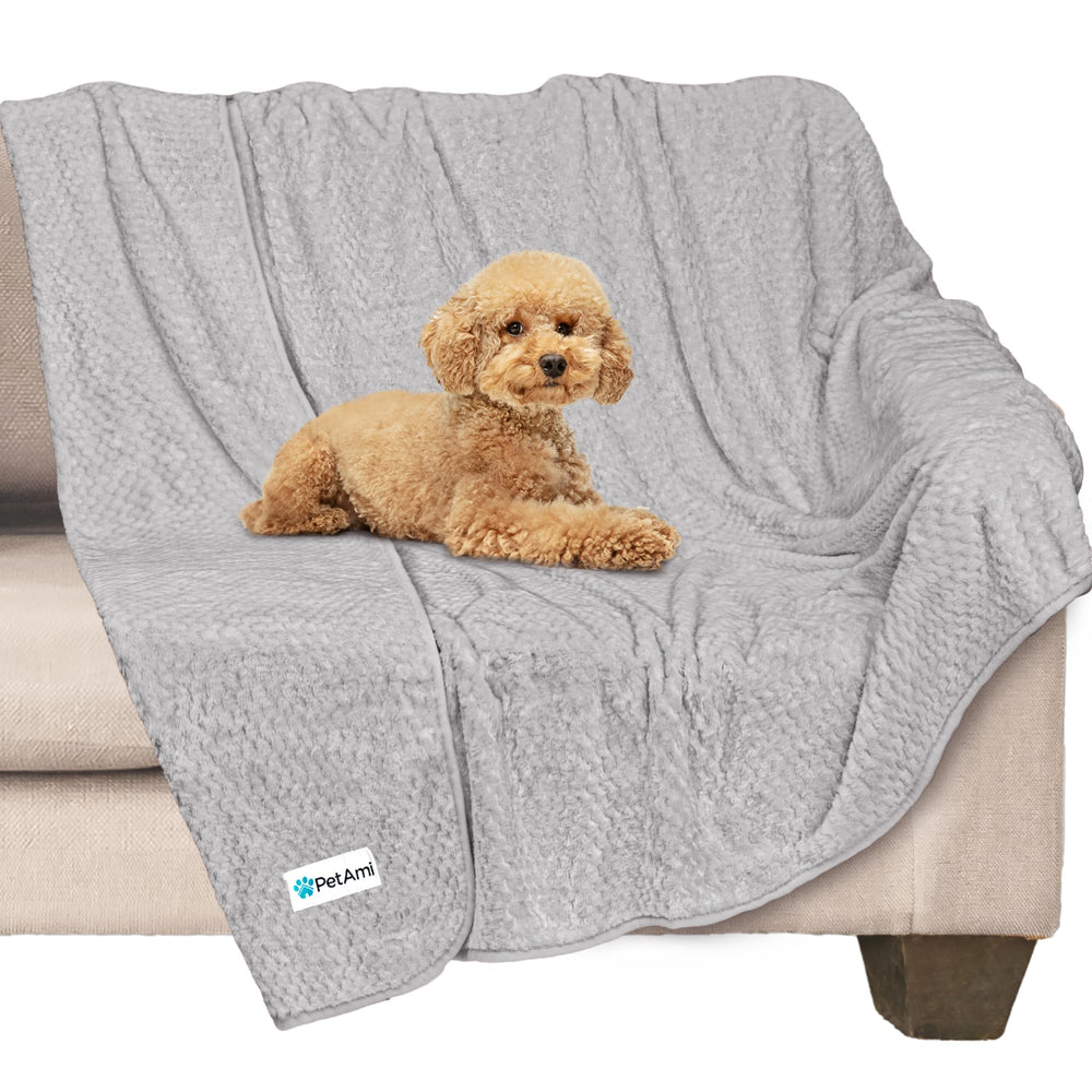 PetAmi waterproof dog blanket on sofa protecting furniture from spills and accidents.