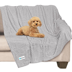 PetAmi waterproof dog blanket on sofa protecting furniture from spills and accidents.